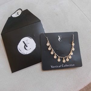 Gold coin bracelet by Vertical Collective